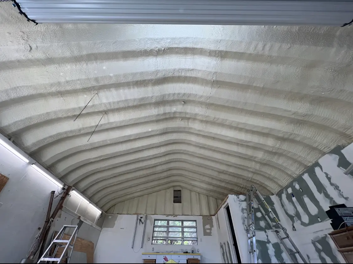 Spray polyurethane foam applied to the underside of a metal roof deck in Cumberland